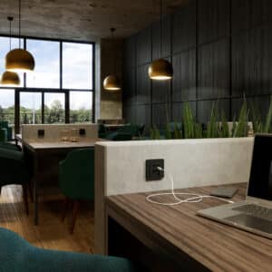 Restaurant- bzw. Cafétische mit jeweils zwei USB C Steckdosen in Tischhöhe von GIRA.