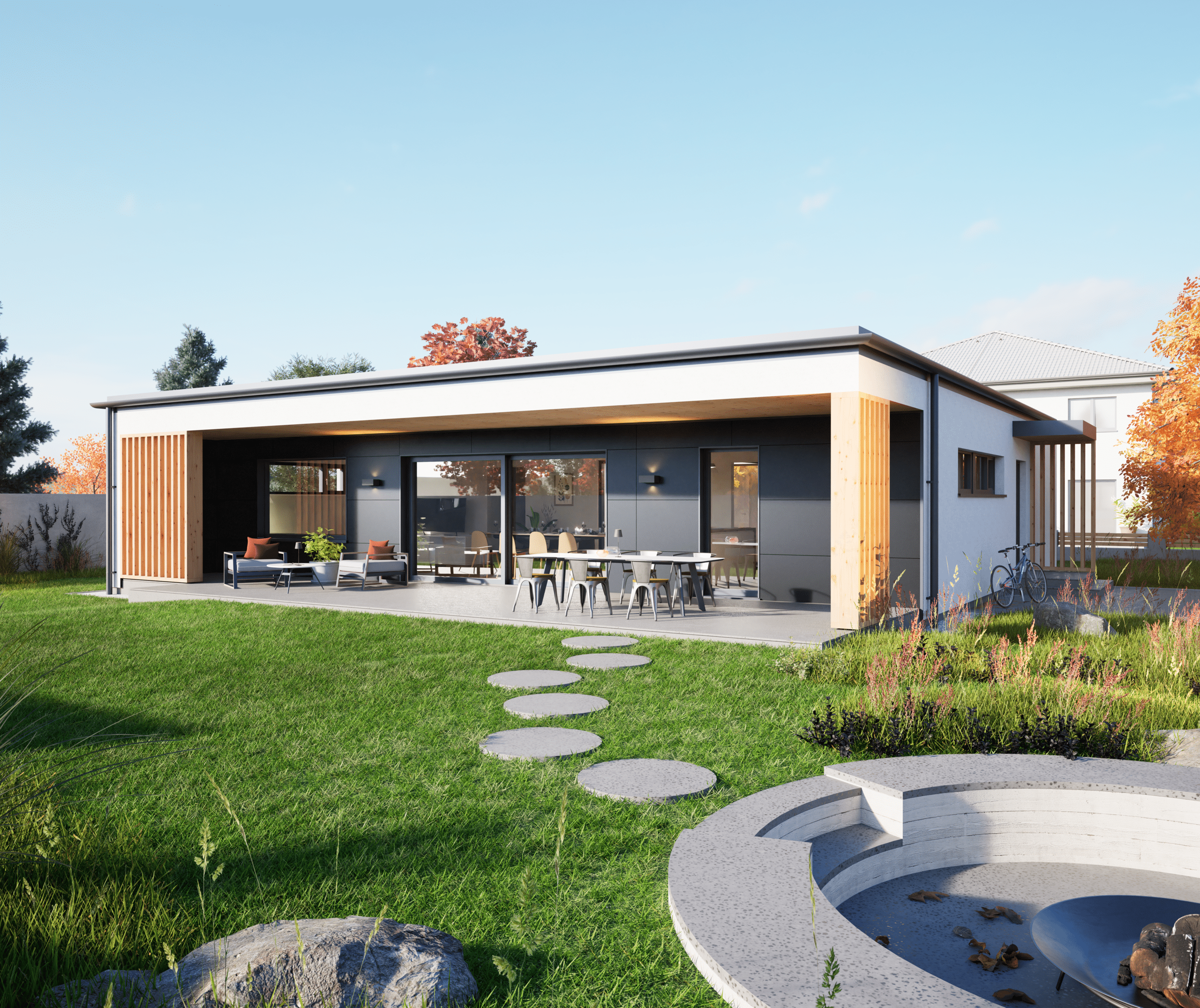 Hartl Haus zeigt Bungalow mit Flachdach und einer großen, nach innen versetzten Terrasse mit runden Trittplatten in den Garten und zum Teich.