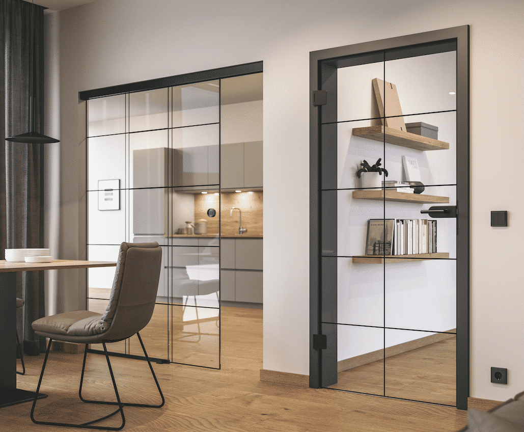 Doppelglasschiebetüre und einer Innentür im gleichen Loftdesign mit schwarzem Türrahmen und schwarzem Türdrücker von Hörmann Austria.