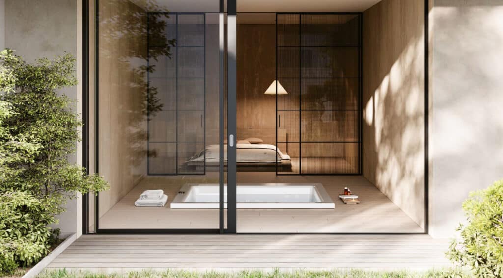 Der quadratische weiße Outdoor-Whirlpool "Gilium" von Disenia - hier in der Unterbauversion in einem japanisch-minimalistisch gestalteten Haus mit barrierefreiem Terrassenzugang.